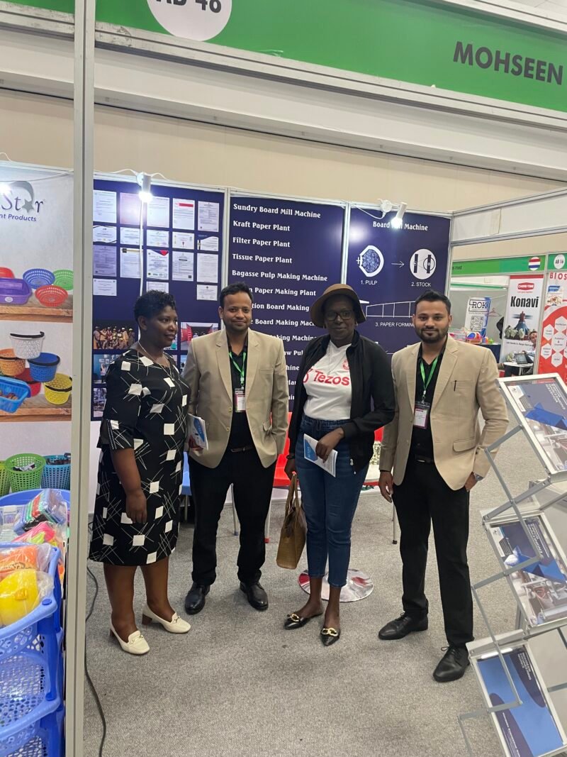 Visitors and MEW representatives beside the product displays